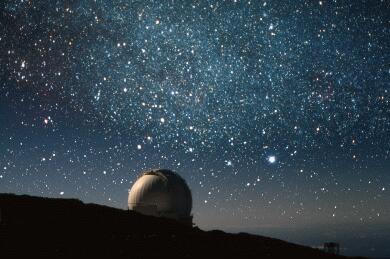The William Herschel Telescope and Sirius. Photo-composite by Nik Szymanek.